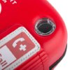 Closeup detail of the red Philips Heartstart FRx defibrillator carry case showing part of the label and a clear circular component