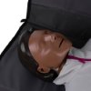 Close up of the face of laerdal little anne training manikin with bag dark skin lying on a dark surface