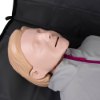 Close up of the face of the laerdal little anne training manikin with bag light skin showing the head and neck