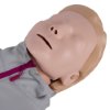 Close-up of the face of the laerdal little anne training manikin with bag light skin showing closed eyes and mouth