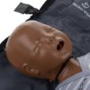 Closeup of laerdal little baby qcpr training manikin head with dark skin resting on a partially visible carry bag