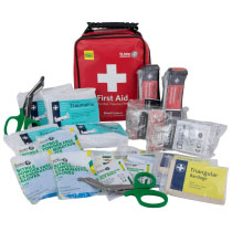 Stjpact1 Tourniquet Kit Contents a red plastic carry case with black handle on the front is a white cross and the words first aid. In the front it shows the entire contents of the trauma kit including bandages gloves and torniquets