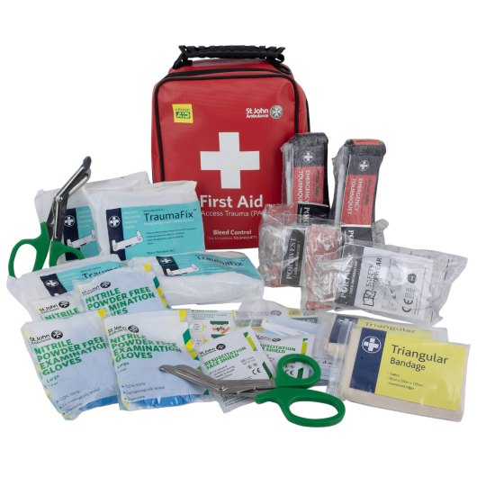 Tourniquet tourniquet kit contents including gloves, bandages, scissors, and other first aid items displayed with a red bag