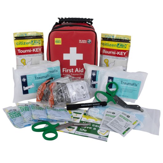 Tourni Key Tourni key kit contents laid out including a red first aid pouch scissors marker and medical supplies