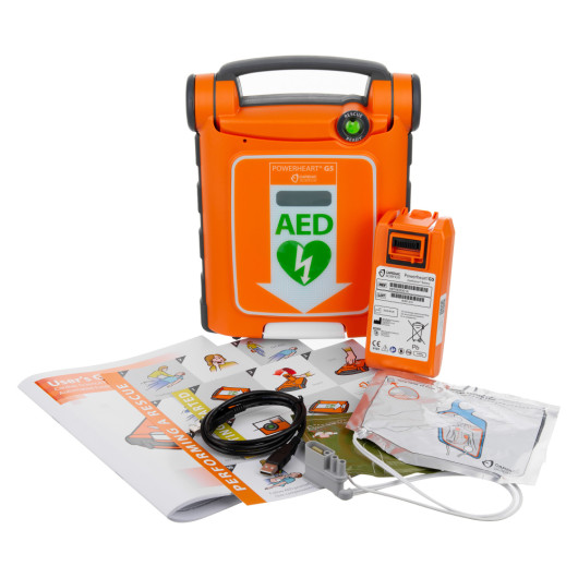 Cardiac Science Powerheart G5 semi automatic defibrillator with orange case and green AED symbol with accessories labeled contents green