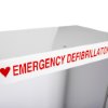 Closeup text on zoll aed plus wall mount cabinet alarm showing emergency defibrillator in red letters with heart symbol