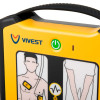Close‑up of a VIVEST AED showing the green power button, indicator light, and illustrated pad‑placement and heart‑rhythm icons.