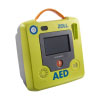 A bright green defibrillator with a large grey LCD screen
