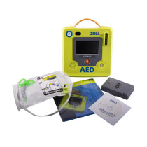 Zoll Aed 3 Fully Auto Defibrillator Contents A bright green defibrillator with a large grey LCD screen and its contents