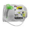A set of white defibrillator pads with a pair of green medical scissors