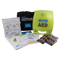 Zoll Aed Plus Fully Automatic All Contents A bright yellow defibrillator with all its contents spread out