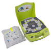 A bright yellow defibrillator with its pads