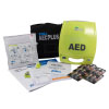 A bright yellow defibrillator with all its contents spread out