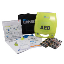 A bright yellow defibrillator with all its contents spread out