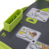 A close-up of the defibrillator screen with user instructions